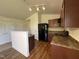 Efficient kitchen with dark cabinets, modern appliances, and ample countertop space at 5219 Merlin Dr, Snow Camp, NC 27349