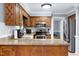 Updated kitchen featuring granite countertops, stainless steel appliances, and abundant wood cabinetry at 5304 W Oaks Dr, Fuquay Varina, NC 27526