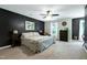 Spacious main bedroom featuring a ceiling fan, a walk-in closet and natural light at 5304 W Oaks Dr, Fuquay Varina, NC 27526
