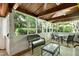 Comfortable screened porch with outdoor furniture, ceiling fans, and a view of the private backyard at 5304 W Oaks Dr, Fuquay Varina, NC 27526