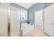 Modern bathroom featuring a tub under the window and a glass-enclosed shower at 5520 Creek Pine Dr, Wake Forest, NC 27587