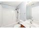 Bright bathroom featuring a bathtub with shower, toilet, and wooden vanity with ample counter space and lighting at 5520 Creek Pine Dr, Wake Forest, NC 27587