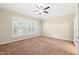 Bright bedroom with carpeting, a ceiling fan, and three large windows at 5520 Creek Pine Dr, Wake Forest, NC 27587