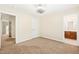 Bedroom with carpet flooring, bathroom, and door at 5520 Creek Pine Dr, Wake Forest, NC 27587