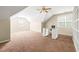 Spacious bonus room features an office space with bright windows, built in shelves, and plush carpet at 5520 Creek Pine Dr, Wake Forest, NC 27587