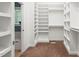 Walk-in closet with built in shelving, carpet and window at 5520 Creek Pine Dr, Wake Forest, NC 27587