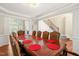Formal dining room with hardwood floors, coffered ceilings and staircase view at 5520 Creek Pine Dr, Wake Forest, NC 27587