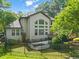 Exterior of home featuring a large deck and a well-maintained, fenced yard at 5520 Creek Pine Dr, Wake Forest, NC 27587