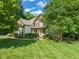 Beautiful two-story home with manicured lawn and lush landscaping at 5520 Creek Pine Dr, Wake Forest, NC 27587
