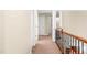 Second floor hallway with wood and iron railing at 5520 Creek Pine Dr, Wake Forest, NC 27587
