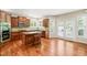 Spacious kitchen featuring wood cabinets, a center island, stainless appliances, and an eat-in breakfast nook at 5520 Creek Pine Dr, Wake Forest, NC 27587