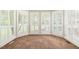Bright, carpeted space with a wall of windows and white shutters for privacy at 5520 Creek Pine Dr, Wake Forest, NC 27587