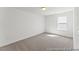 Bright bedroom with neutral carpet, large window, and ample natural light at 56 Mable Court # 20, Lillington, NC 27546