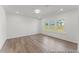 Bright bedroom with large windows offering pleasant views and wood flooring throughout at 56 Mable Court # 20, Lillington, NC 27546