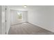 Bedroom featuring neutral carpet, natural light from the window, and base molding at 56 Mable Court # 20, Lillington, NC 27546