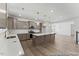Spacious kitchen featuring ample counter space, a large center island, pendant lighting, and modern appliances at 56 Mable Court # 20, Lillington, NC 27546