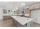 Well-appointed kitchen with an expansive island, stylish pendant lights, and plenty of cabinet storage space at 56 Mable Court # 20, Lillington, NC 27546