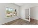 Cozy office space featuring ample natural light, a glass-paneled door, and hardwood flooring at 56 Mable Court # 20, Lillington, NC 27546