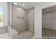 Modern tiled walk-in shower with glass door and built-in shelving niches at 56 Mable Court # 20, Lillington, NC 27546
