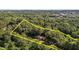 Aerial view of a home surrounded by lush forest, highlighting the expansive property and natural setting at 5900 Ebenezer Church Rd, Raleigh, NC 27612