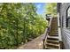 Backyard features a custom staircase leading down to an additional viewing platform at 5900 Ebenezer Church Rd, Raleigh, NC 27612