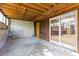 Unfinished basement space with concrete floor and access to the outdoors at 5900 Ebenezer Church Rd, Raleigh, NC 27612