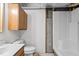 Simple bathroom with a standard toilet, sink, vanity, and shower stall at 5900 Ebenezer Church Rd, Raleigh, NC 27612