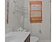 A bathroom includes a sink, toilet, and window with decor and hardware at 5900 Ebenezer Church Rd, Raleigh, NC 27612