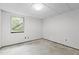 Unfinished bedroom with a single window and visible electrical wiring at 5900 Ebenezer Church Rd, Raleigh, NC 27612