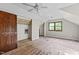 A spacious bedroom features natural light, closet space and an overhead ceiling fan at 5900 Ebenezer Church Rd, Raleigh, NC 27612