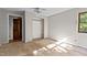 Bright bedroom with neutral paint, ceiling fan, and natural light at 5900 Ebenezer Church Rd, Raleigh, NC 27612