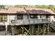 Rear view of house showing the back deck at 5900 Ebenezer Church Rd, Raleigh, NC 27612