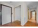 Bright hallway with an open closet and multiple entry points at 5900 Ebenezer Church Rd, Raleigh, NC 27612