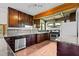 Well-equipped kitchen featuring stainless appliances, granite counters and wood cabinets at 5900 Ebenezer Church Rd, Raleigh, NC 27612