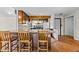 Inviting kitchen showcasing a breakfast bar with granite countertops, and dark cabinets at 5900 Ebenezer Church Rd, Raleigh, NC 27612