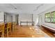 Open living area featuring hardwood floors, ceiling fan and natural lighting at 5900 Ebenezer Church Rd, Raleigh, NC 27612