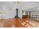 Open living area with wood floors, tall ceilings, and natural light at 5900 Ebenezer Church Rd, Raleigh, NC 27612