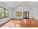 Bright living room featuring hardwood floors and access to the backyard at 5900 Ebenezer Church Rd, Raleigh, NC 27612
