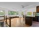 Sunlit living room boasts a dining area, blending indoor comfort with scenic outdoor views at 5900 Ebenezer Church Rd, Raleigh, NC 27612