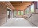 Enclosed sunroom featuring natural wood and ample natural light at 5900 Ebenezer Church Rd, Raleigh, NC 27612