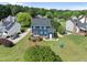 Aerial view of a well-maintained home with a large backyard, deck, and beautiful landscaping at 6 W Canterbury Ct, Wendell, NC 27591