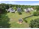 Aerial view of the home and the surrounding community shows a park-like setting at 6 W Canterbury Ct, Wendell, NC 27591