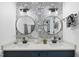 Bathroom featuring double sinks, decorative wallpaper, and modern fixtures at 6 W Canterbury Ct, Wendell, NC 27591
