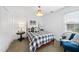 Bedroom featuring plaid bedding, a wood bed frame, and a window with natural light at 6 W Canterbury Ct, Wendell, NC 27591