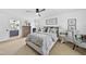 Cozy bedroom with a queen bed, side tables, and a view into the Primary bathroom at 6 W Canterbury Ct, Wendell, NC 27591