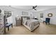 Well-lit bedroom featuring a ceiling fan, neutral tones, and decorative furniture at 6 W Canterbury Ct, Wendell, NC 27591