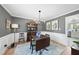 Dining room showcasing a vintage hutch, modern chandelier, and hardwood flooring at 6 W Canterbury Ct, Wendell, NC 27591