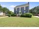 Charming two-story home with a manicured lawn, black shutters, and a bright green front door at 6 W Canterbury Ct, Wendell, NC 27591