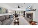 Bright living room with hardwood floors, a fireplace, and comfortable seating furniture at 6 W Canterbury Ct, Wendell, NC 27591