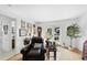 Bright living room with hardwood floors and stylish decor leading to an outdoor patio at 6 W Canterbury Ct, Wendell, NC 27591